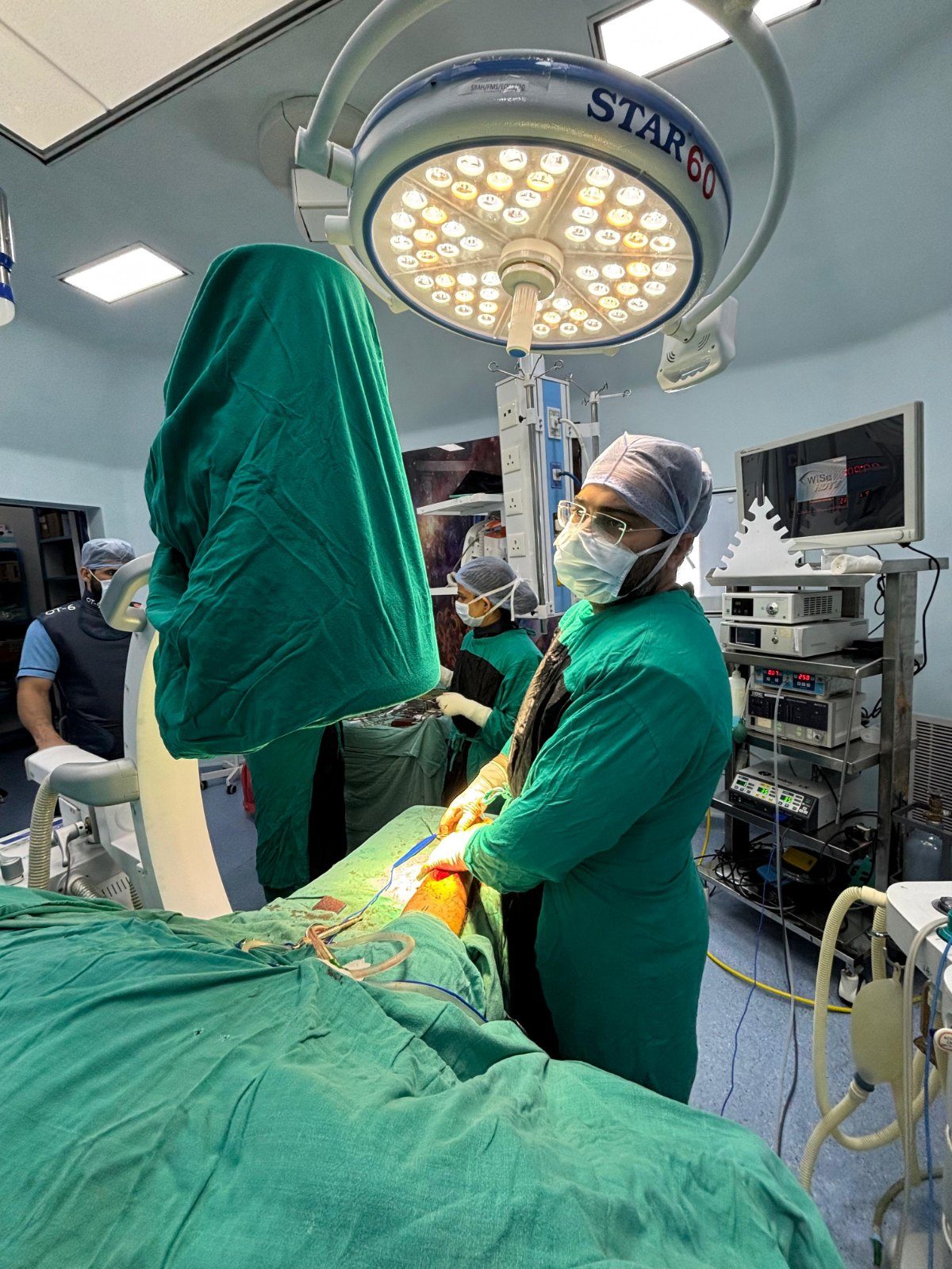Knee surgery in progress in an operating theatre